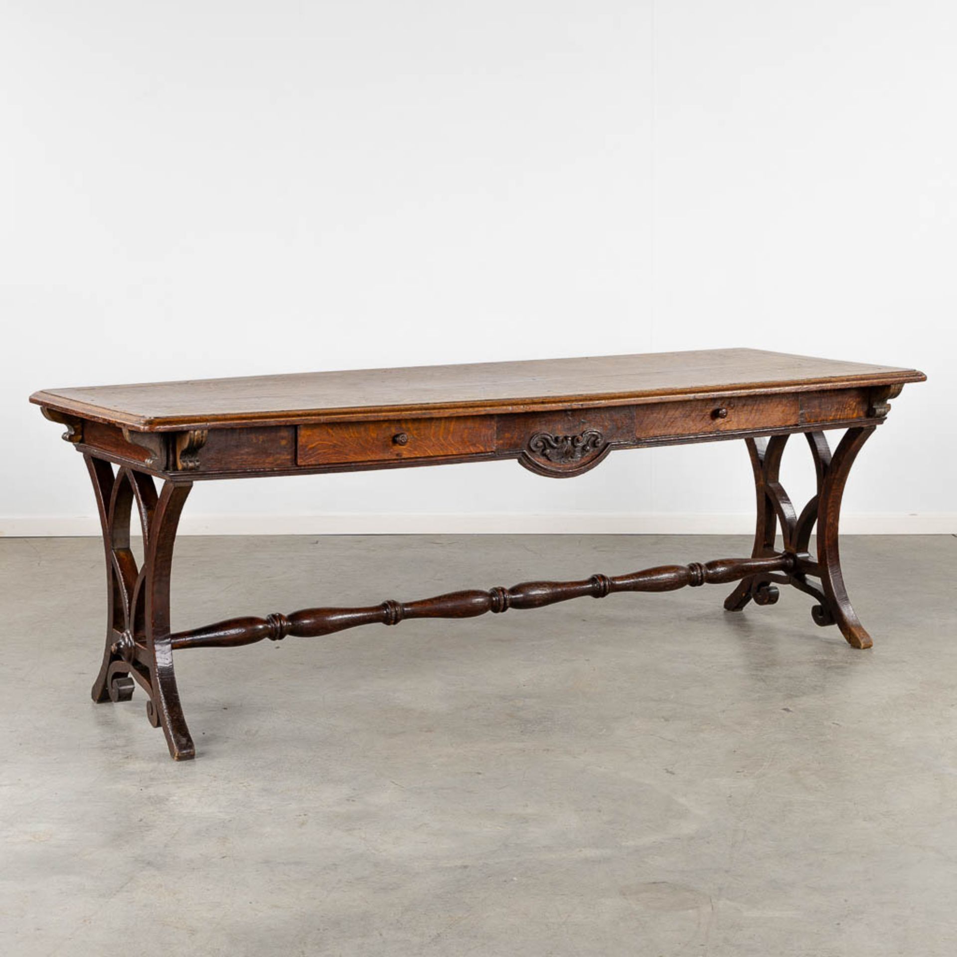 An antique desk/table with sculptures and a drawer, oak. 19th C. (L:77 x W:217 x H:76 cm)