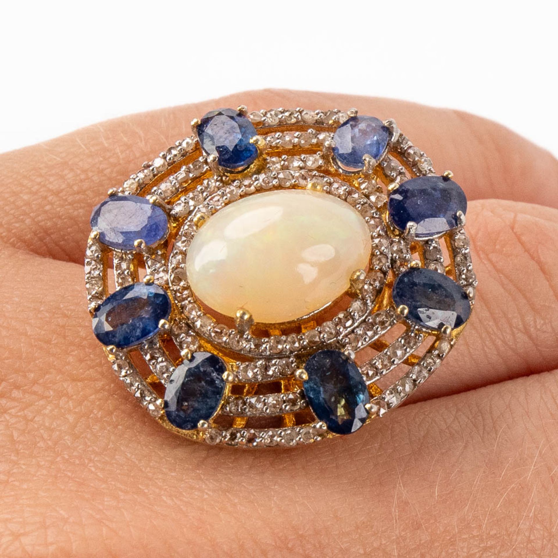 A ring, gilt silver with an Opal, sapphires, opal and 'old cut' diamonds. Ring size: 57. 10,26g. - Image 11 of 11