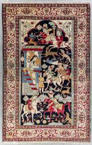 An Oriental hand-made carpet with figurines, Isfahan/Isphahan. Circa 1900. (L:216 x W:138 cm)
