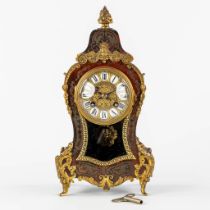 A table clock, tortoise shell inlay mouted with bronze in the style of Boulle. Napoleon 3, 19th C. (