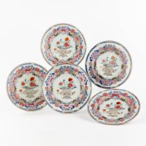 Five Chinese Famille Rose chargers with a floral decor, 18th/19th C. (D:25 cm)