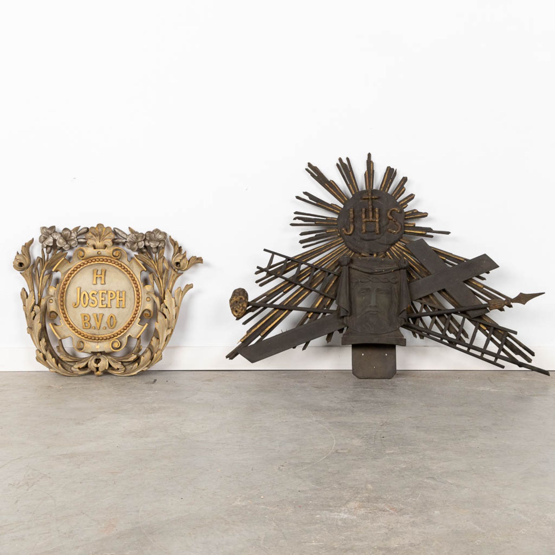 A pair of religious wood sculptures, Joseph B.V.O &amp; IHS with Veil of Veronica, sunbursts. (W:89