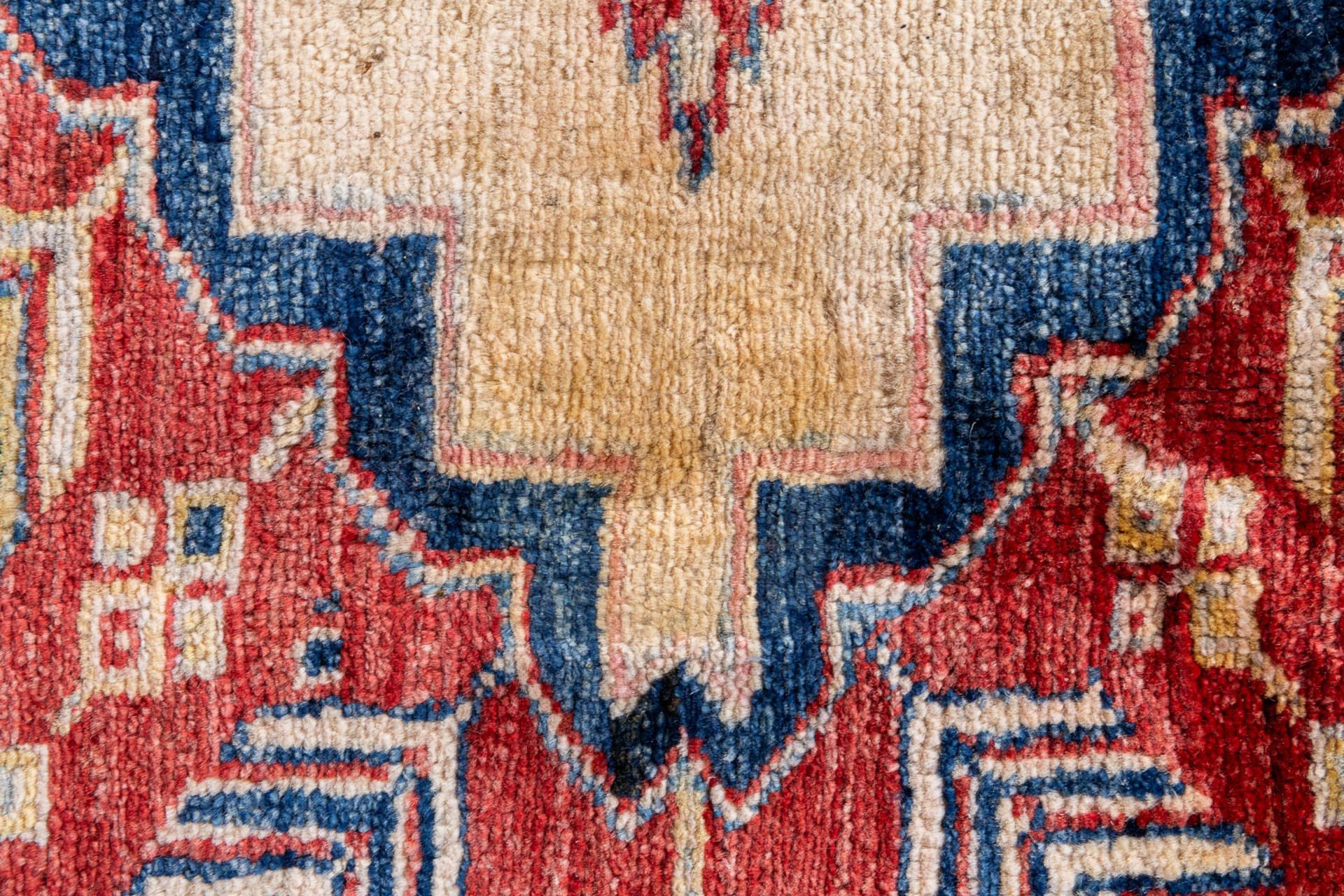 A large Oriental hand-made carpet, Ghazhi, Afganistan. (L:312 x W:455 cm) - Image 10 of 13