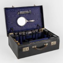 A large traveller's toilet set, Silver and glass, Birmingham and London, UK. Circa 1940-1946. (L:40