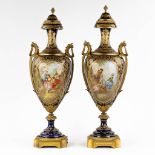 Svres, a pair of cobalt blue vases, hand-painted double deecor and mounted with bronze. 19th C. (L: