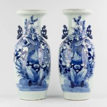 A pair of Chinese celadon vases with a blue-white decor of phoenixes. 19th/20th C. (W:23 x H:58 cm)