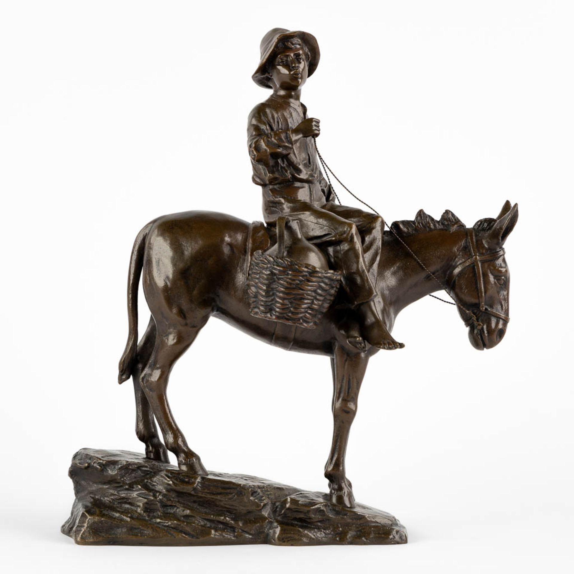 A small figurine of a young man riding a donkey, patinated bronze. Circa 1900. (L:18 x W:28 x H:33 c - Image 3 of 10