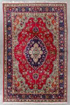 An Oriental hand-made carpet, Tabriz. (L:299 x W:199 cm)