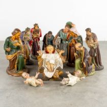 An 11-piece 'Nativity scène', polychrome plaster. (H:64 cm)