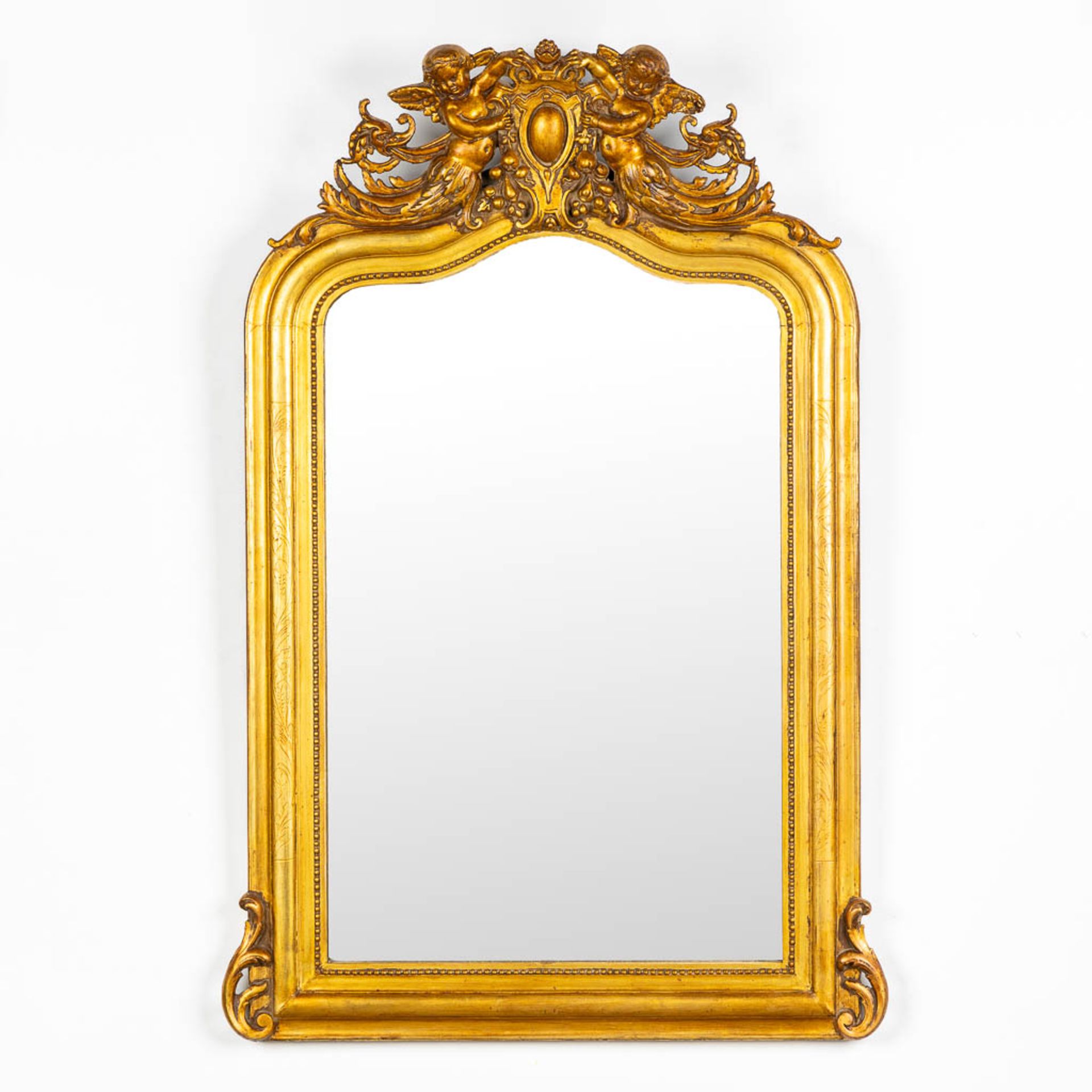 An antique mirror, gilt wood and stucco. Circa 1900. (W:82 x H:122 cm)