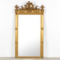 An antique mirror, sculptured wood, stucco decorated with a Putto and mythological figurines. Circa