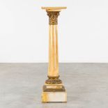 A pedestal finished with a Corinthian pillar. Bronze and onyx. Circa 1880. (L:33 x W:33 x H:123 cm)