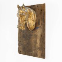 An antique gilt zinc Horse Head, mounted on a wood board. Circa 1920. (L:31 x W:15 x H:42 cm)
