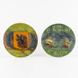 Two ceramic plates, Flemish Earthenware: 'Vliegt de Blauwvoet storm op zee' en 'Vlaanderen den Leeuw