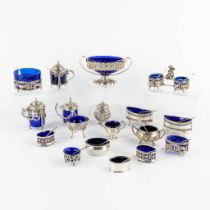 18 pepper and salt jars, blue glass and silver with spoons. Various makers, mostly England. 1165g. (