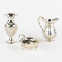A milkjug, saucer and small vase, silver. England. 611g. (H:16 x D:8 cm)