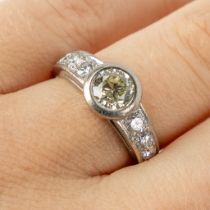 A ring, 18kt white gold with a large brilliant, appr. 1ct. and other diamonds, appr. 0,6ct. 7,66g. R