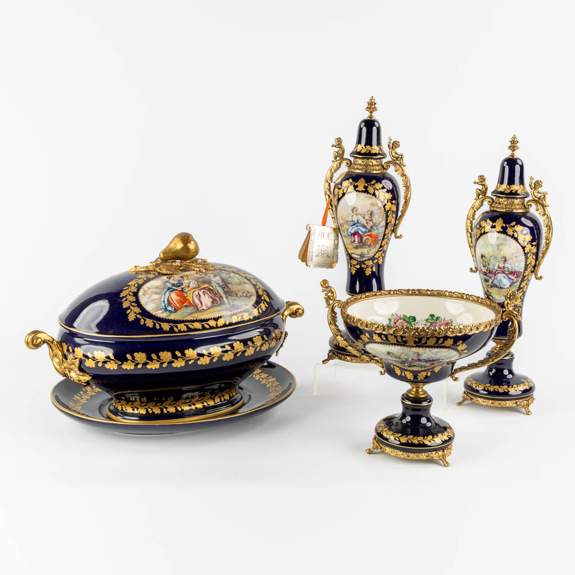 A.C.F. Sèvres, 4 items, cobalt-blue and bronze mounted porcelain. (L:29,5 x W:41 x H:26 cm)