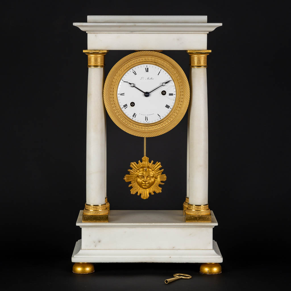 A column clock, white marble mounted with bronze L.Mallet H. de M. D. d'Orléans, n° 937. Empire. (L: