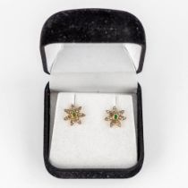 A pair of earrings, gilt silver with 'old cut' diamonds and emeralds. 2,53g.