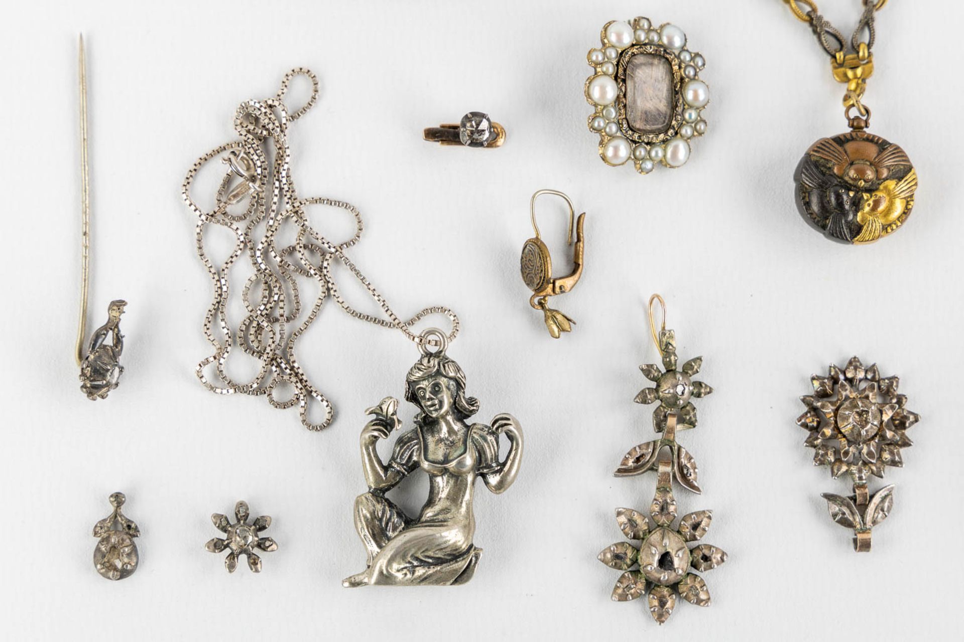 A collection of silver brooches, pendants, earrings and a pin with old-cut diamonds. 117g. - Image 3 of 15