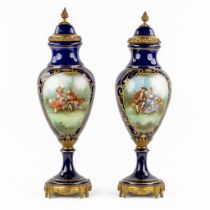 Sèvres, a pair of bronze-mounted vases with hand-painted decor. (H:70 x D:21 cm)