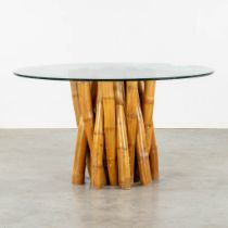 A large round dining room table, faux bamboo base. (H:76 x D:135 cm)