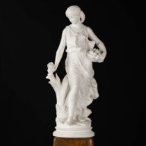 Hippolyte MOREAU (1832-1927) 'Lady with flowers' sculptured Carrara marble. (L:25 x W:35 x H:80 cm)