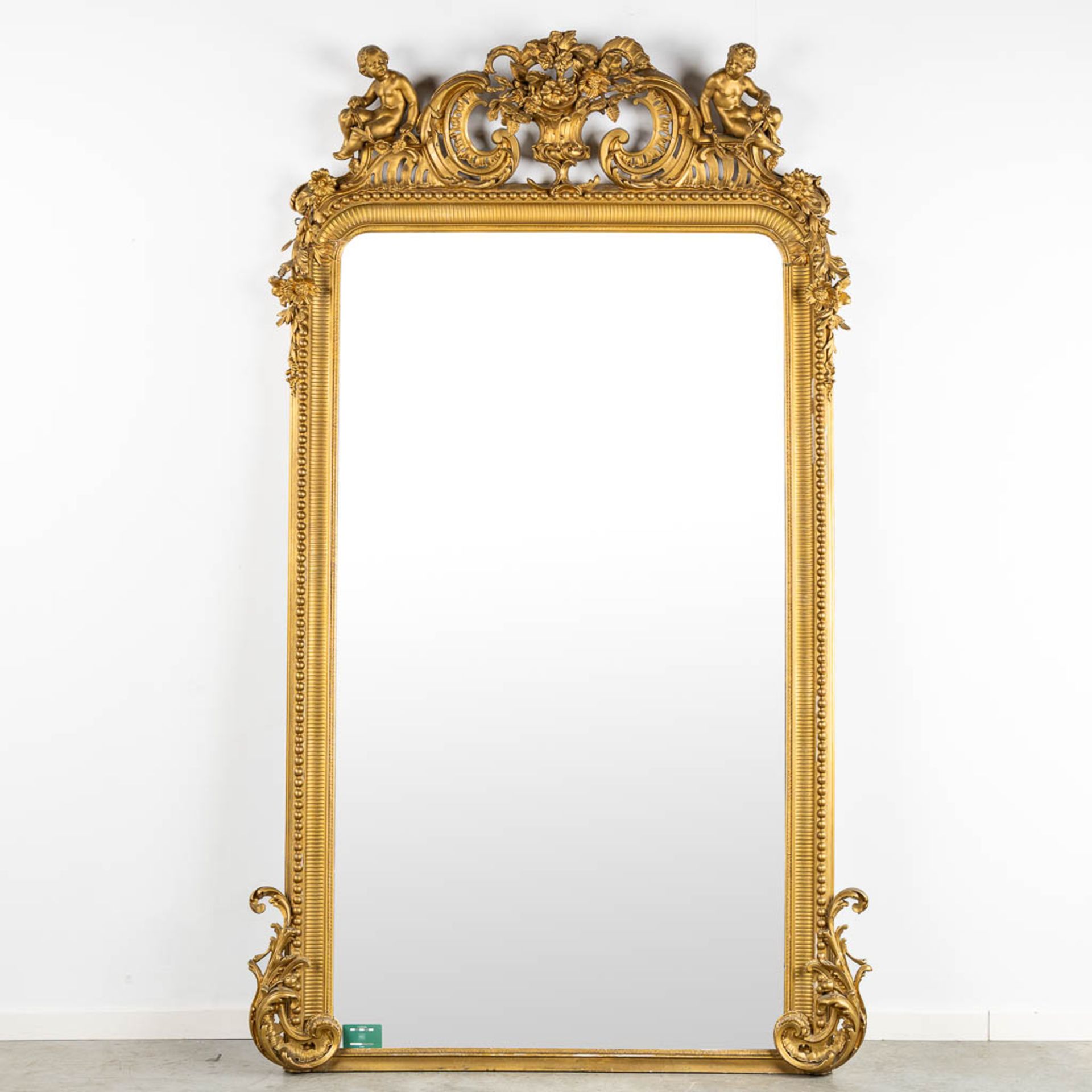 An antique and large mirror, decorated with putti in Louis XV style. Circa 1900. (W:130 x H:225 cm) - Image 2 of 11