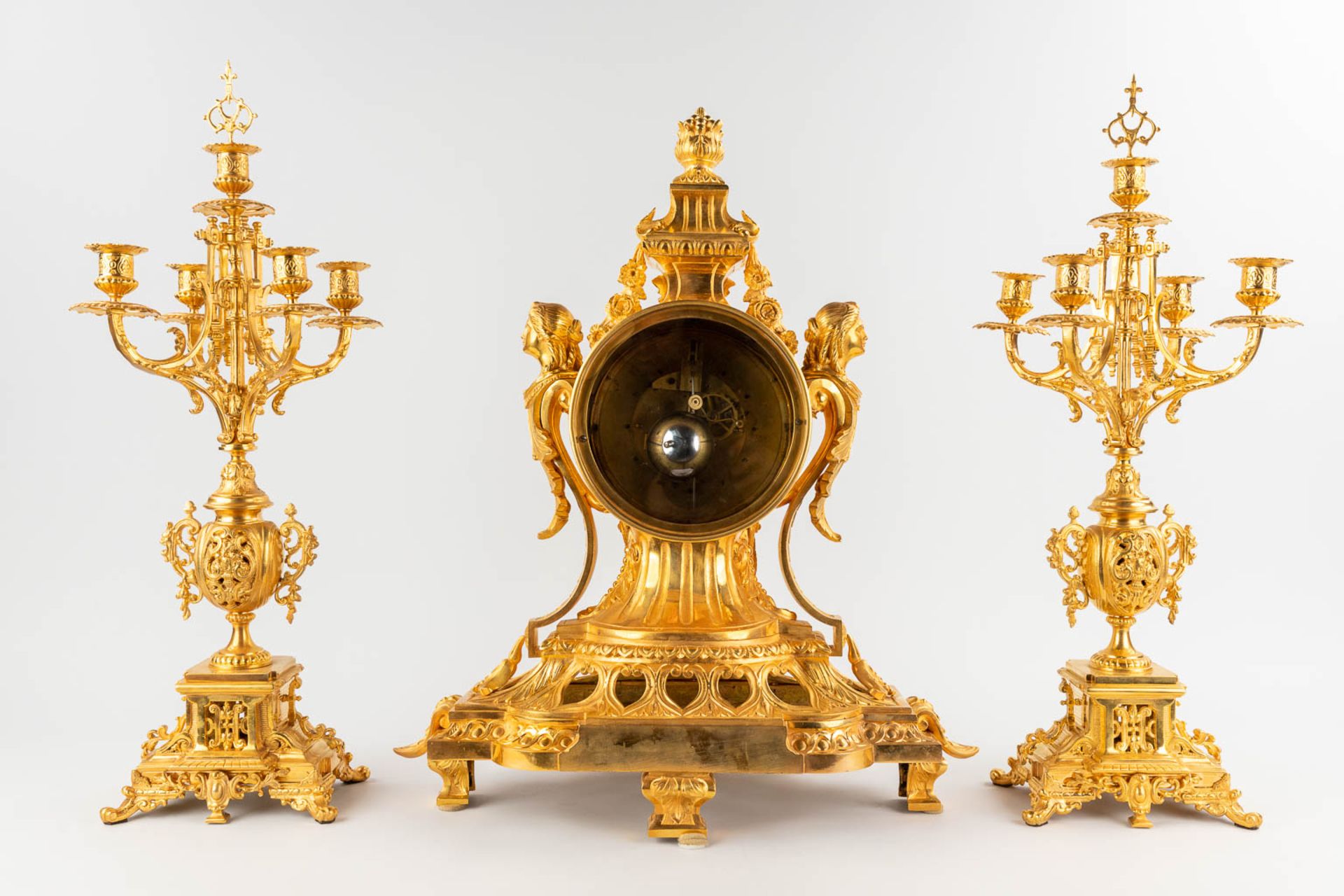 A three-piece mantle garniture clock and candelabra, gilt bronze in Louis XV style. 19th C. (L:28 x - Image 6 of 16
