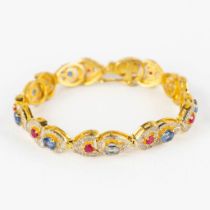A bracelet, gilt silver with rubies, Kyanite and 'old cut' diamonds. 18,65g. (L:17,5 cm)