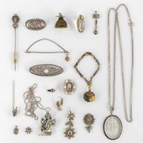 A collection of silver brooches, pendants, earrings and a pin with old-cut diamonds. 117g.