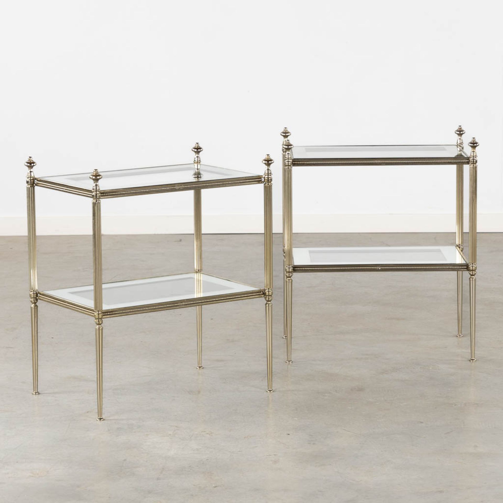 A pair of two-tier side tables, silver-plated metal and mirrored glass. 20th C. (L:34 x W:50 x H:58