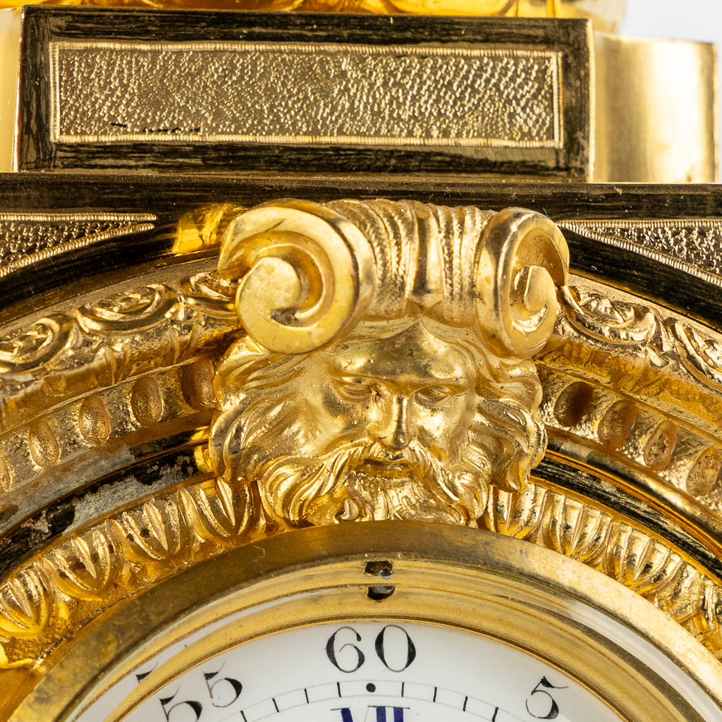 A gilt bronze mantle clock, richly decorated with putti, ram's heads and garlands in Louis XV style. - Image 10 of 16