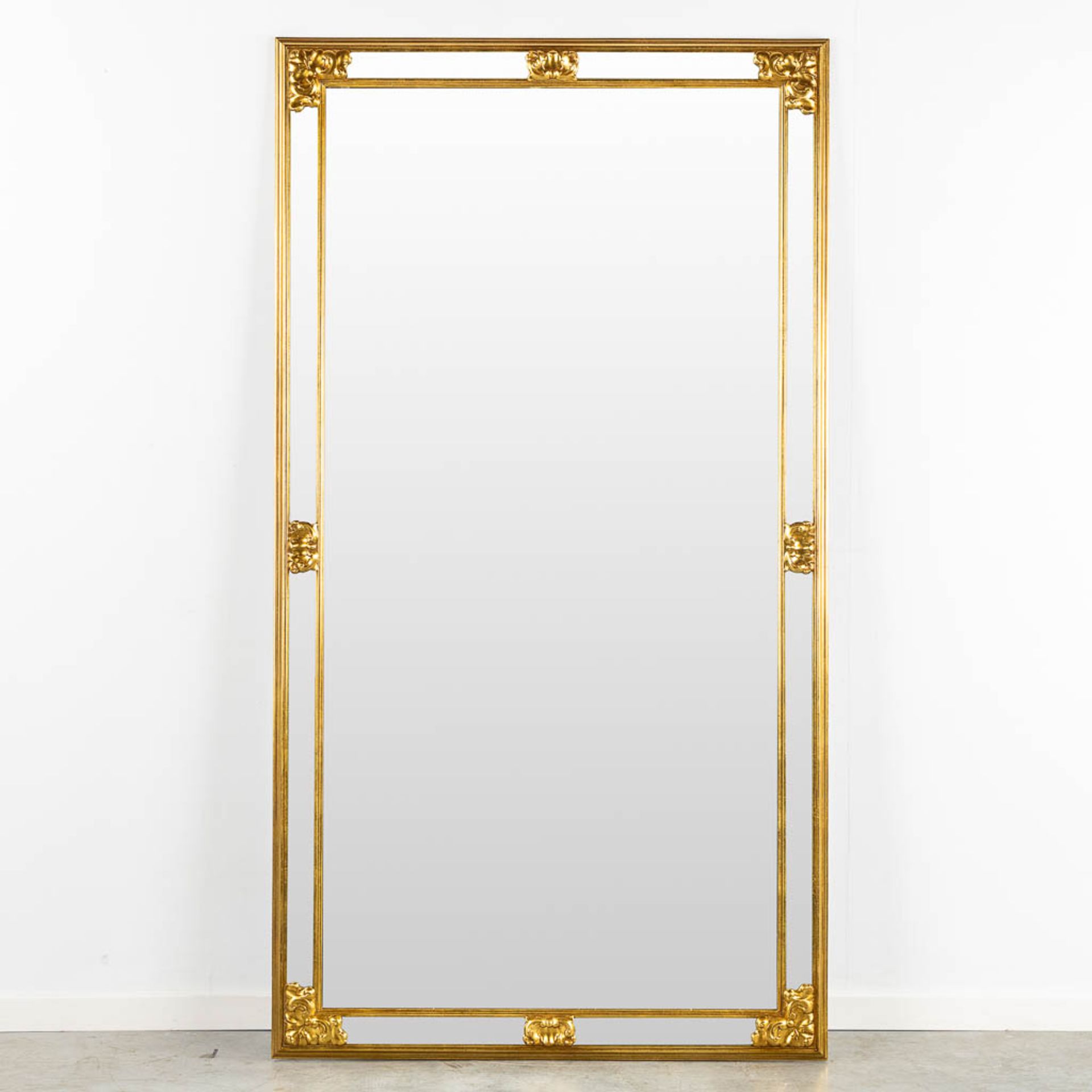 Deknudt, a mirror, gilt wood. (W:102 x H:185 cm)