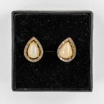 A pair of earrings, gilt silver with a cabochon opal and 'old cut' diamonds. 4,28g.