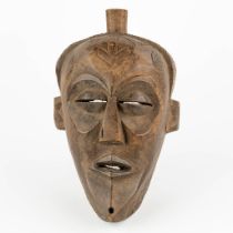 A decorative mask in the style of Chokwe. 20th C. (L:17 x W:21 x H:38 cm)