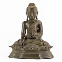 A large and antique Birman Buddha, patinated bronze, 19th C. (L:23 x W:37 x H:45 cm)