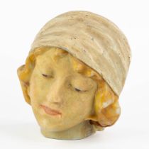 A patinated wax ladies head, Art Deco. Circa 1920. (L:18 x W:17 x H:20 cm)