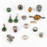 A collection of Silver jewellery, rings, earrings, pendants and brooches. Amber facetted glass and o