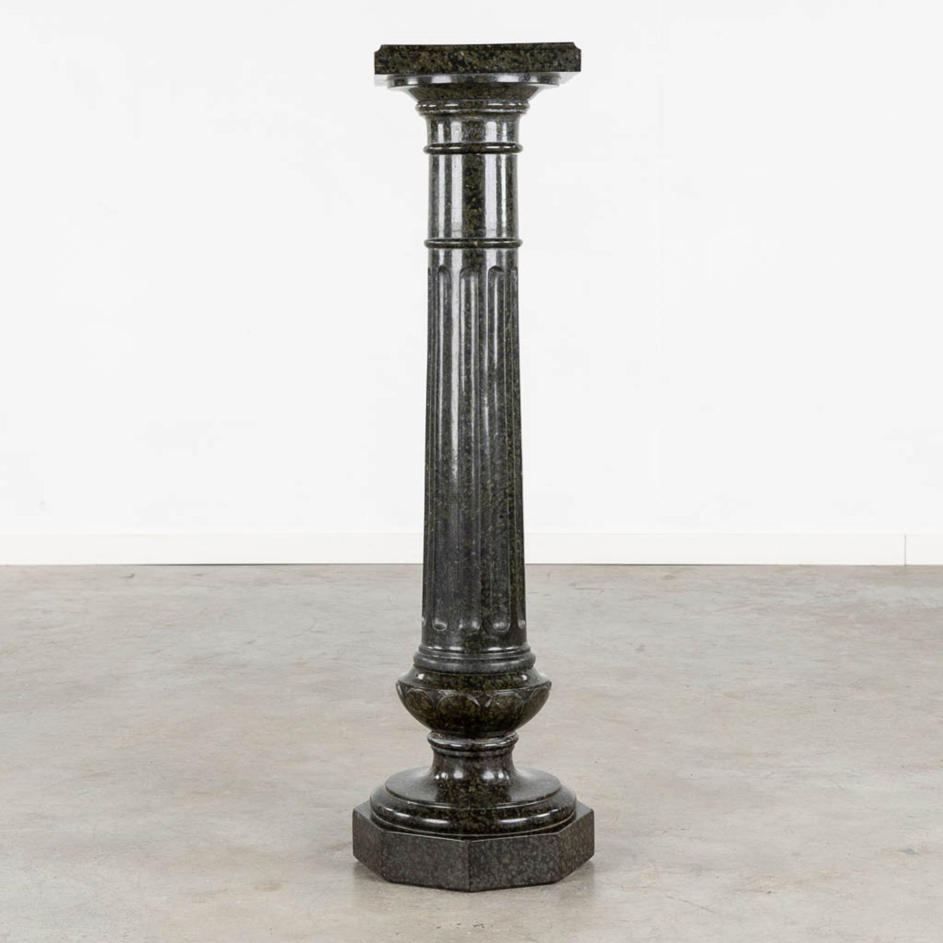 An antique black, sculptured marble pedestal. 19th C. (L:28 x W:28 x H:107 cm)