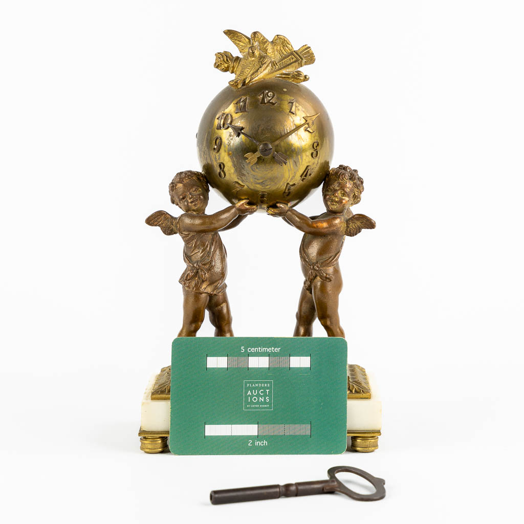 A Louis XVI style Mantle Clock, Putti holding a globe. Gilt bronze. Circa 1900. (L:8 x W:12 x H:21 c - Image 2 of 12