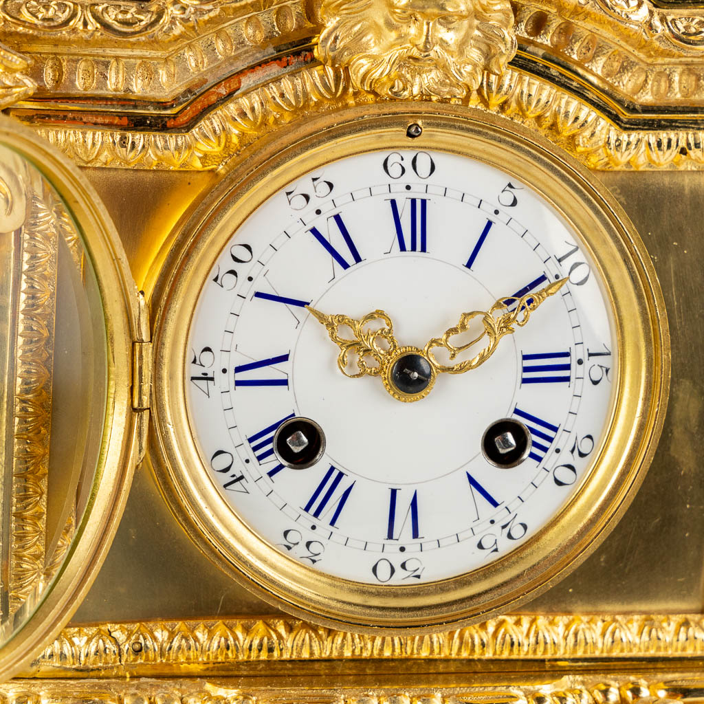 A gilt bronze mantle clock, richly decorated with putti, ram's heads and garlands in Louis XV style. - Image 11 of 16