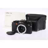 A Black Leica R5 35mm SLR Body,