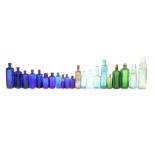 A Collection of Coloured Chemists Dispensing Bottles,