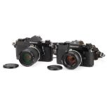 Two Black Nikon Nikkormat 35mm SLR Cameras