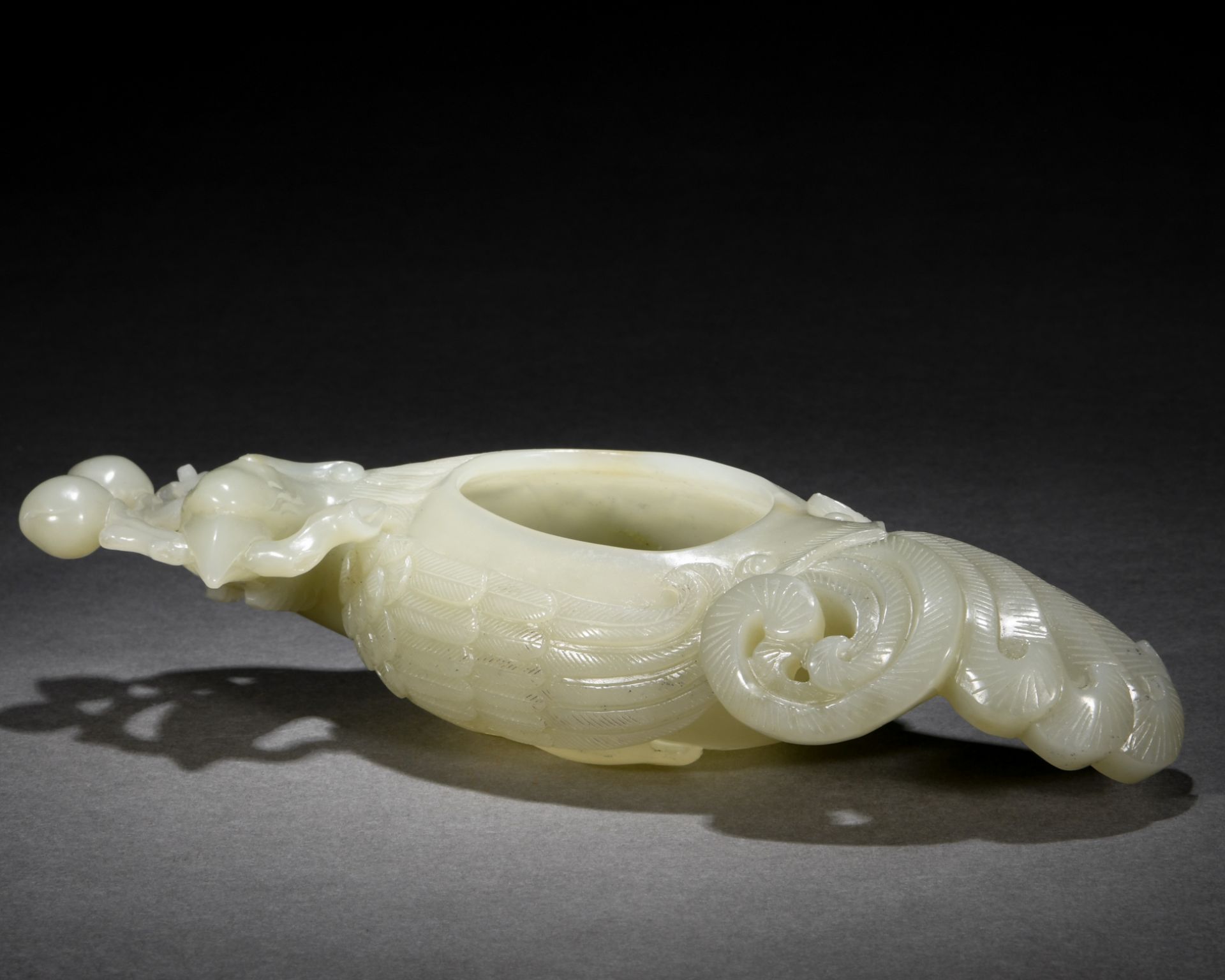 A Chinese Carved White Jade Washer