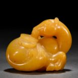 A Chinese Carved Yellow Jade Horse