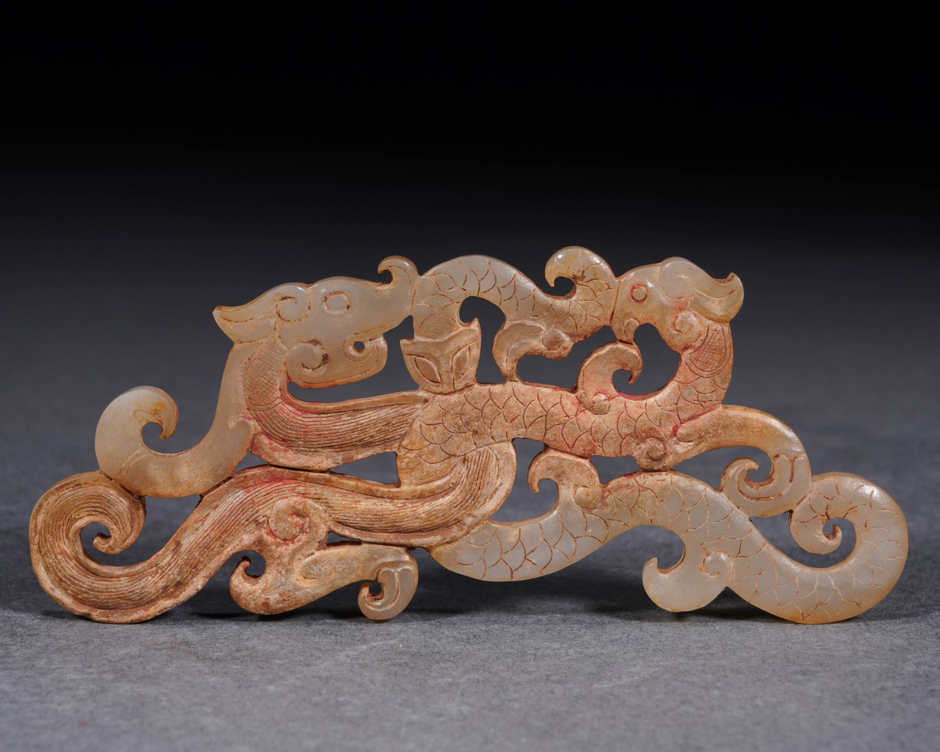 A Chinese Carved Jade Interlocked Dragon Ornament