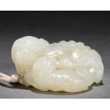 A Chinese Carved White Jade Beast